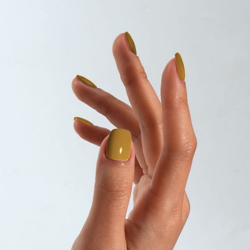 Close-up of a professional square-shaped manicure using S&L Gel Polish No. 030 Peas Please solid yellow- brown polish.