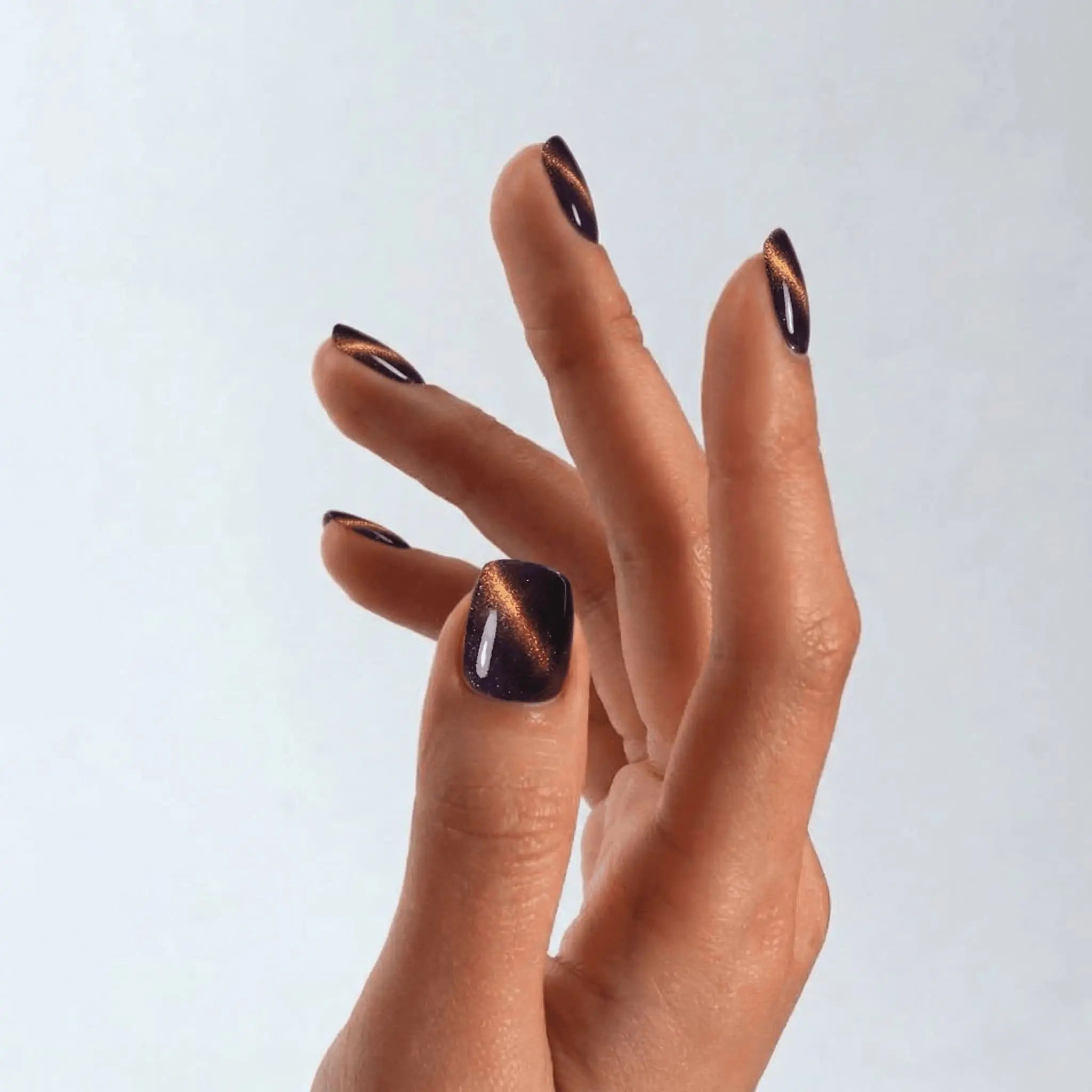 Close-up of a professional square-shaped manicure using S&L Gel Polish No. 082 Ophelia purple cat-eye polish.