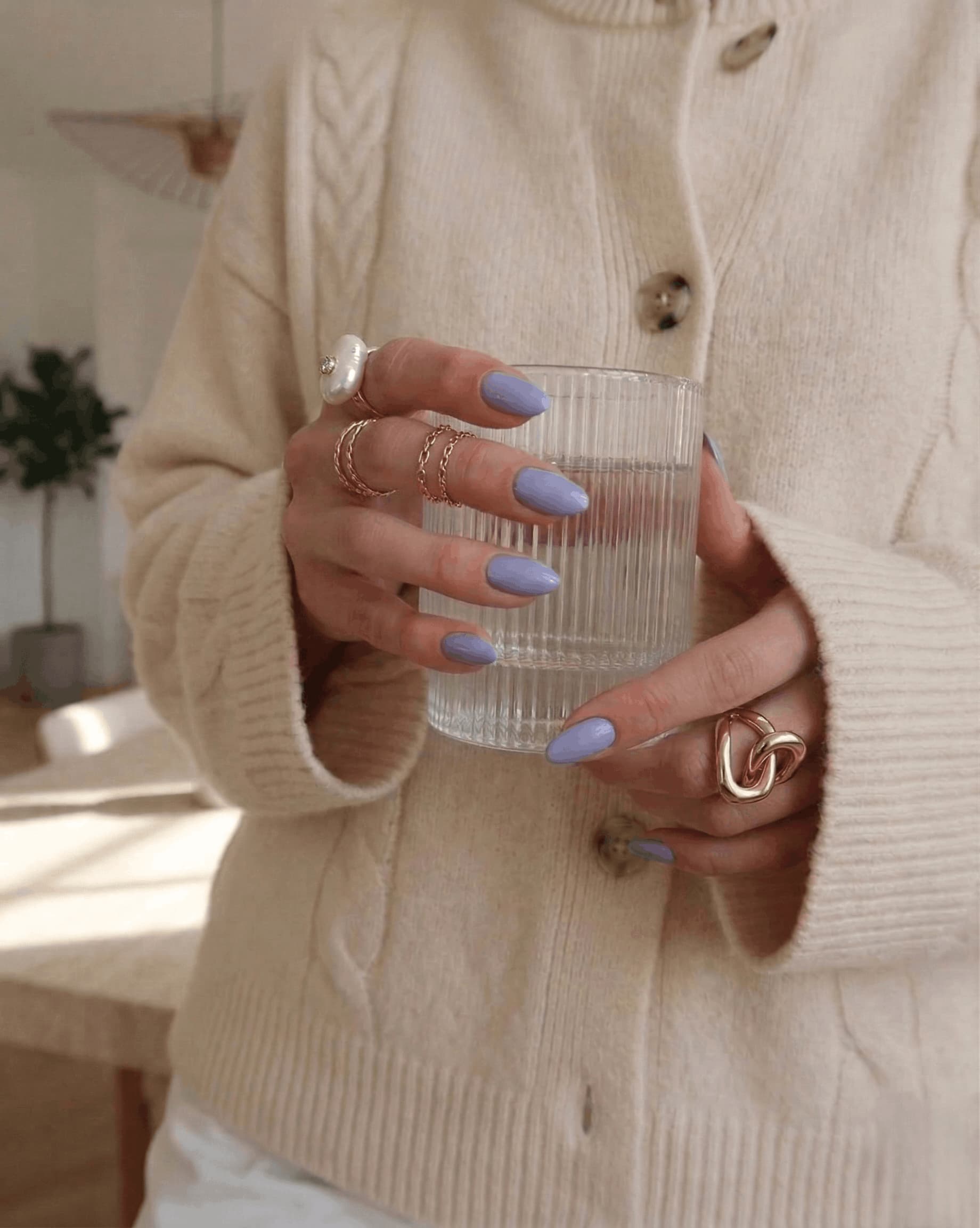 Hand with light blue grey nail polish