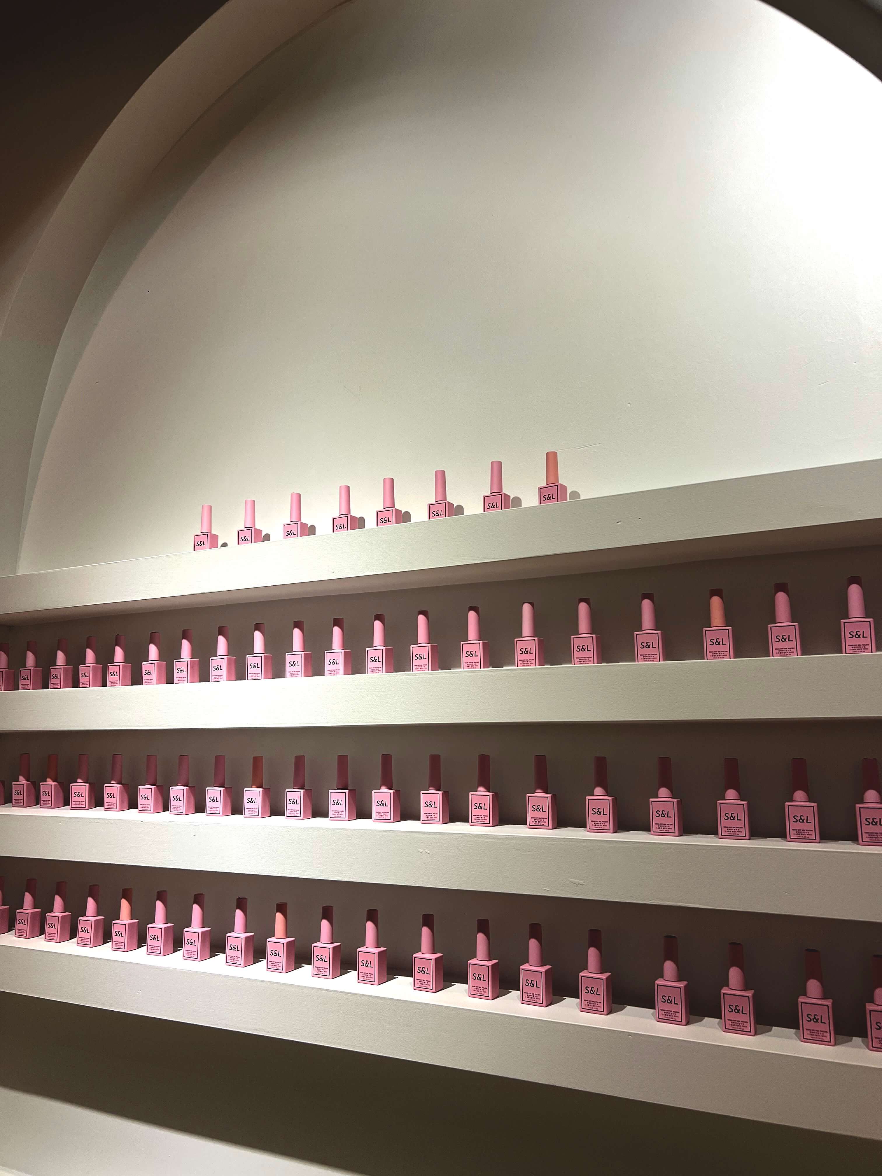 Nail salon wall of S&L gel polish bottles