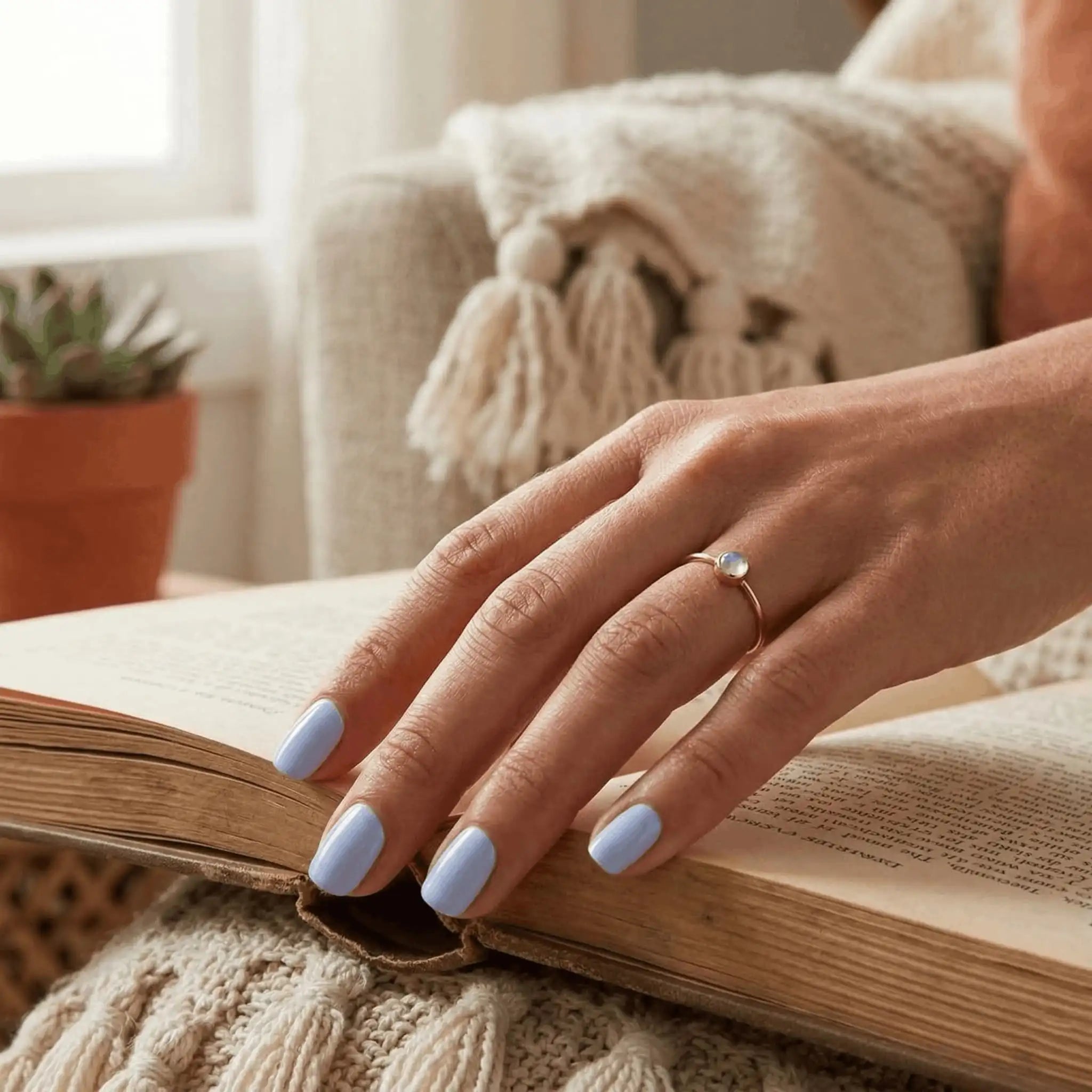 Minimalist lifestyle photography featuring a hand model with square nails in S&L No. 007 Ocean Cruise solid blue