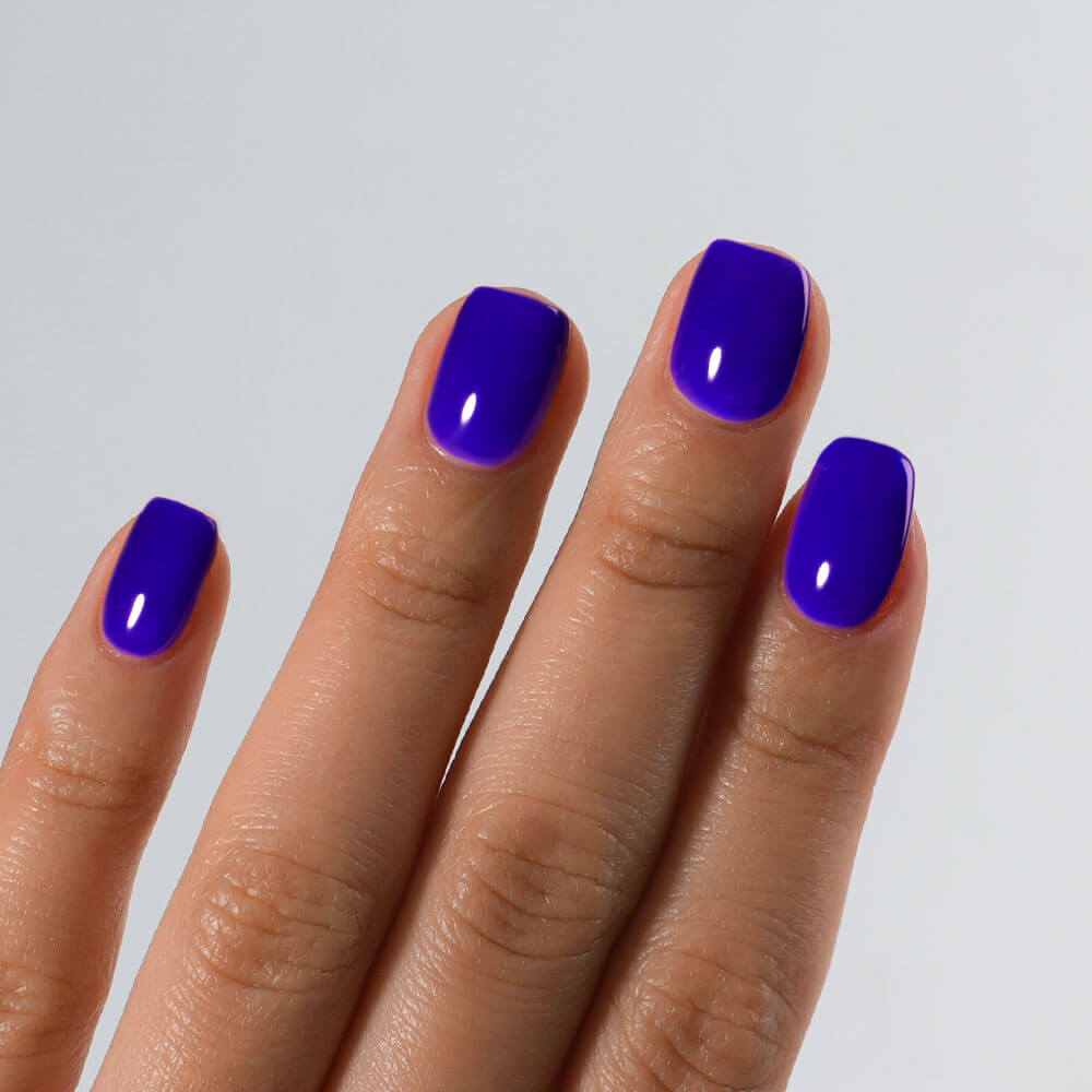Detailed view of S&L No. 059 Ultrasonic Blue gel polish on square nails with a high-gloss shiny finish.