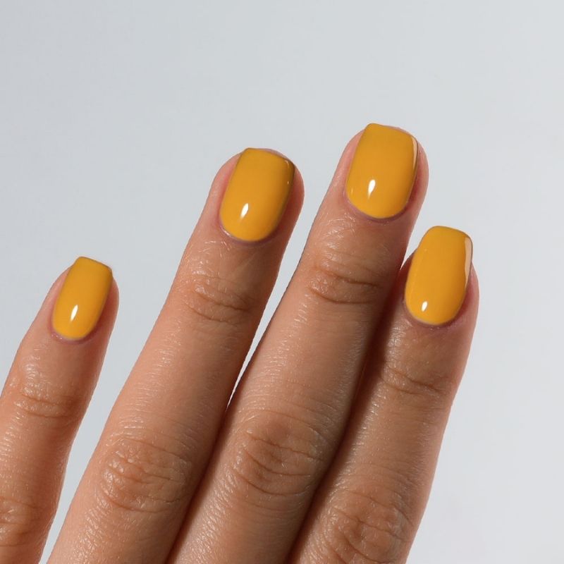 Detailed view of S&L No. 048 Canary Yellow gel polish on square nails with a high-gloss shiny finish.