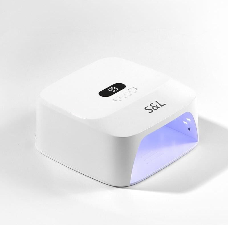 S&L White gel nail lamp dryer with blue uv led light on a white background